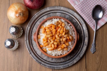 Photo for Traditional Turkish cuisine. Kuru Fasulye . Haricot Beans, rice and beans (Turkish name; pilav ustu kuru fasulye) - Royalty Free Image
