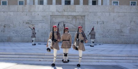 Photo for July 4, 2022, Greece Syntagma Square changing of the guard in front of the monument to the unknown. Presidential guard in traditional uniform are marching in front of Tomb of Unknown Soldier in city - Royalty Free Image