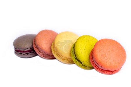 Photo for Colorful macaroon cakes. Small french muffins. Colorful macarons on a white background - Royalty Free Image