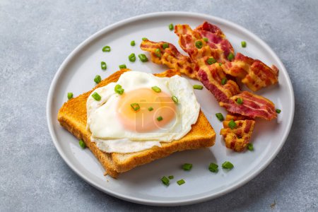 Photo for Fried eggs with bacon. Bacon and egg as English breakfast. - Royalty Free Image