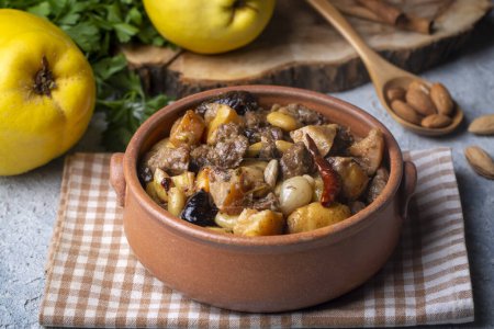 Photo for Traditional delicious Turkish foods; Quince and plum lamb stew, lamb tandoori (Turkish name; Ayvali - erikli kuzu guvec - kuzu tandir - Royalty Free Image
