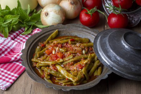 Photo for Traditional delicious Turkish food; Green beans with olive oil; Turkish name; Zeytinyagli taze fasulye - Royalty Free Image