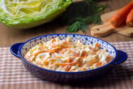 Photo for Coleslaw salad close up on a bowl. Cabbage, carrot salad. (Turkish name; lahana salatasi) - Royalty Free Image
