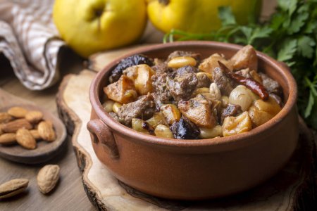 Foto de Traditional delicious Turkish foods; Quince and plum lamb stew, lamb tandoori (Turkish name; Ayvali - erikli kuzu guvec - kuzu tandir - Imagen libre de derechos