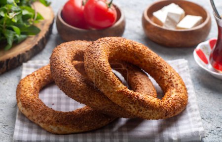 Photo for Turkish fast food bagel called Simit. Turkish bagel Simit with sesame. Bagel is traditional Turkish bakery food. Turkish name; simit - gevrek - Royalty Free Image