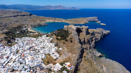 Photo for The Acropolis of Lindos in Rhodes island Greece. Saint Paul's Beach and Lindos Acropolis aerial panoramic view. - Royalty Free Image