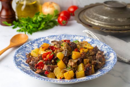 Photo for From Turkish cuisine; meat, vegetable kebab, casserole. Turkish name; Maras Tava or Kahramanmaras Tava - Orman Kebabi - Royalty Free Image