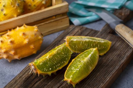 Photo for Kiwano fruit; Horned melon is known by such names as African horned melon or melon, jelly melon, hedged gourd, English Tomato, melano, or kiwano or "cherie". - Royalty Free Image