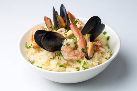 Photo for Mediterranean risotto with shrimps, mussels, octopus and clams. Seafood risotto - Royalty Free Image