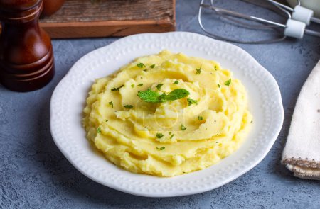 Photo for Serving of creamy mashed potato made from boiled potatoes - Royalty Free Image