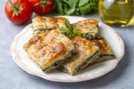 Photo for Greek cuisine; Spinach Tart or Spinach Pie. Turkish name; ispanakli borek or ispanakli tart - Royalty Free Image