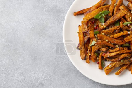 Photo for Sweet potato fries homemade roasted in the oven - Royalty Free Image
