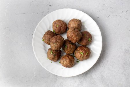 Photo for Round shaped balls of dry meatballs and french fries. Turkish name; kuru kofte ve patates - Royalty Free Image