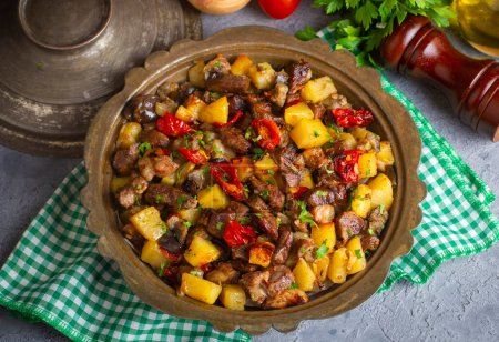 Photo for From Turkish cuisine; meat, vegetable kebab, casserole. Turkish name; Maras Tava or Kahramanmaras Tava - Orman Kebabi - Royalty Free Image