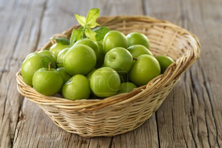 Photo for Close Up Of Green Plums Or Greengage In A Basket - Royalty Free Image