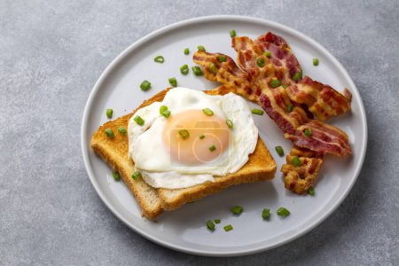 Photo for Fried eggs with bacon. Bacon and egg as English breakfast. - Royalty Free Image