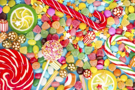Photo for Colorful lollipops and different colored round candy. Top view. - Royalty Free Image
