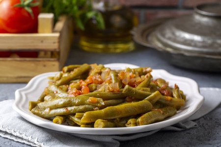 Photo for Traditional delicious Turkish food; Green beans with olive oil; Turkish name; Zeytinyagli taze fasulye - Royalty Free Image