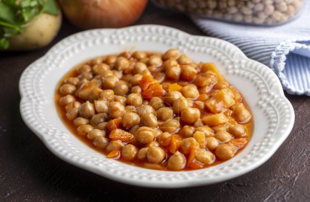 Photo for Traditional delicious Turkish food; Chickpea stew (Turkish name; Nohut pilaki) - Royalty Free Image