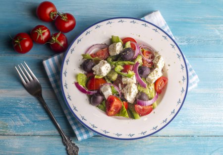 Photo for Greek salad with fresh vegetables, feta cheese and kalamata olives. Healthy food. - Royalty Free Image