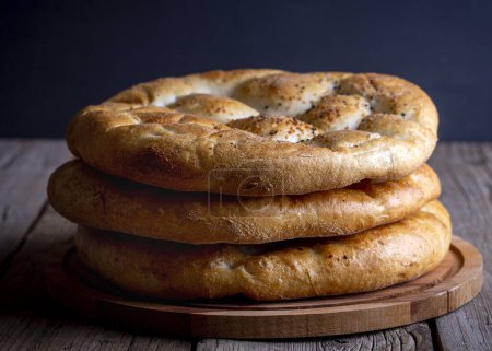 Photo for Ramadan Pita (Turkish name; Ramazan Pidesi) Traditional Turkish bread for holy month Ramadan - Royalty Free Image