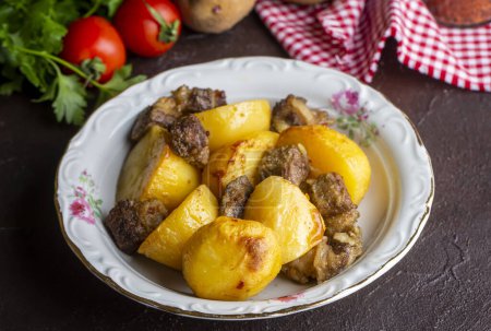 Photo for From traditional delicious Turkish food; potato and meat dish in casserole (Turkish name; Guvec tas kebabi, tandir) - Royalty Free Image