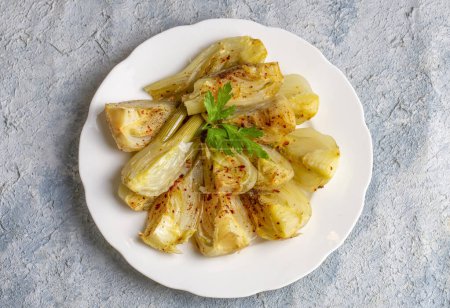 Photo for Organic Baked Fennel Bulbs with Salt and Pepper. Fennel dish with olive oil. - Royalty Free Image