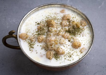 Photo for Cold Yogurt Soup with Chickpeas and Wheat Seeds - Ayran asi Corbasi - Tzatziki - Royalty Free Image