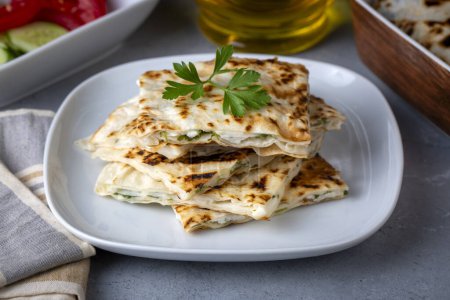 Photo for Traditional Turkish food, Turkish pancake gozleme with cheese and herb. - Royalty Free Image