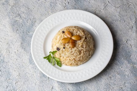 Photo for Traditional delicious Turkish food; Almond rice pilaf (Turkish name; Bademli pirinc pilavi) - Royalty Free Image