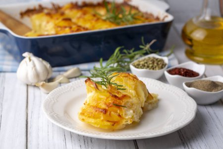 Photo for Potato gratin - graten (baked potatoes with cream and cheese) . Turkish name; Kremali patates - Royalty Free Image