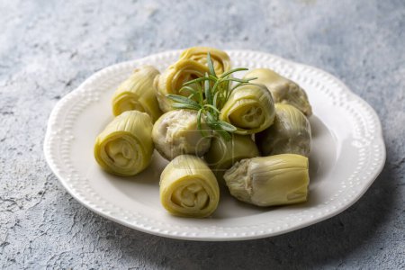 Photo for Pickled Artichoke Hearts with Marinated in Plate. - Royalty Free Image