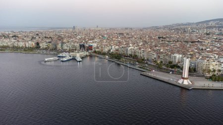 Photo for Karsiyaka - Izmir - Turkey, September 20, 2021, Karsiyaka ferry pier and monument shooting with drone - Royalty Free Image