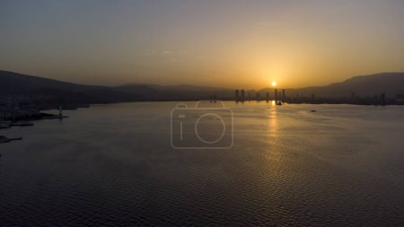 Photo for Turkey Izmir Karsiyaka Bostanli Ferry Pier sunset view aerial shot with drone, January 11, 2023. - Royalty Free Image