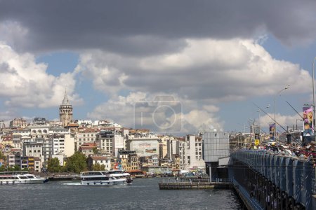Photo for Istanbul - Turkey, February 18, 2021, Fisherman and Peoples on Galata Bridge - Royalty Free Image