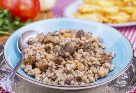 Photo for Traditional delicious Turkish foods; meat bulgur pilav (asir pilav) - Royalty Free Image