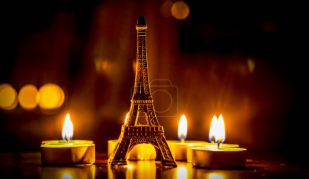 Photo for Small eiffel tower figure and candles - Royalty Free Image