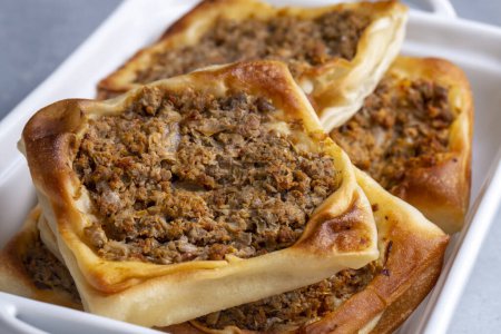 Photo for Traditional delicious Turkish foods; Kaytaz pastry with minced meat of Turkey Hatay - Antakya region (Turkish name; Kaytaz boregi) - Royalty Free Image
