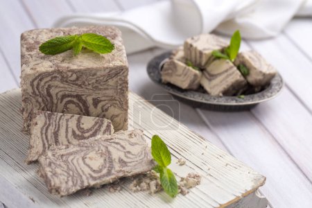 Photo for Halva dessert with sesame paste and cacao on white - Royalty Free Image