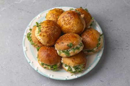 Photo for Turkish pastry filled with dill, parsley, cream cheese and cheddar cheese. Turkish name: Sakall Pogaca - Royalty Free Image