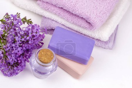Photo for Lilac nature cosmetics, handmade preparation of essential oils, perfume, creams, soaps from fresh and lilac flowers - Royalty Free Image