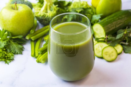Photo for A glass of green celery juice. Celery drink prepared for healthy nutrition and detox. - Royalty Free Image