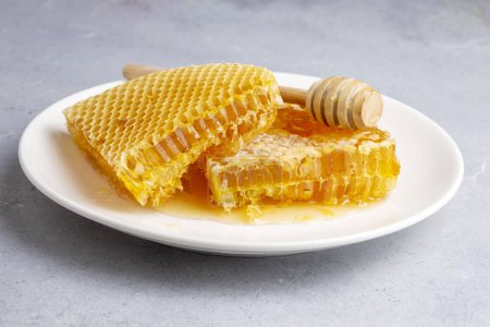 Foto de Sweet honeycomb isolated on white bee products with organic natural ingredients concept - Imagen libre de derechos