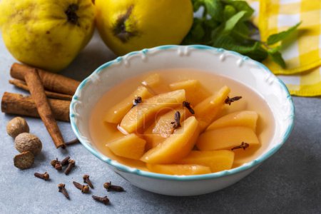 Foto de Quince compote. Compote or compote is a type of dessert prepared by boiling fruits with sugar water. Turkish name; ayva kompostosu - Imagen libre de derechos