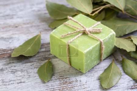 Photo for Organic natural handmade bay laurel soap with olive oil and leaves, daphne soap body care and cosmetic concept - Royalty Free Image