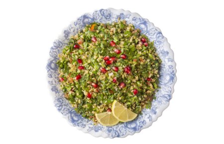 Photo for Tabbouleh salad is a traditional middle eastern or arab dish. Vegetarian salad with parsley, mint, bulgur, tomato. Turkish name; Tabule salatasi - Royalty Free Image