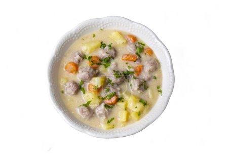 Photo for Seasoned soup with meatballs with vegetables. Turkish name; sulu kofte, eksili kofte, terbiyeli kofte) - Royalty Free Image
