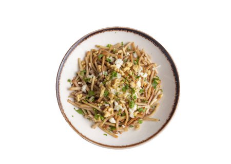 Photo for Turkish Noodle - Eriste with cheese, walnuts and parsley. - Royalty Free Image