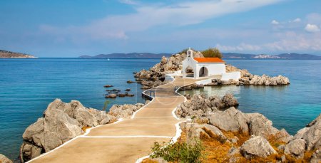 Photo for Authentic traditional Greek islands- unspoiled Chios, little church in the sea over the rocks Agios Isidoros. Eastern Aegean islands - Royalty Free Image