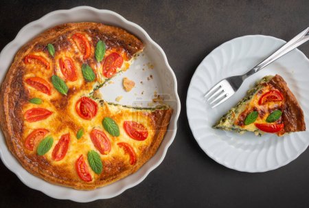 Photo for Vegetarian homemade pie, Quiche with tomatoes, spinach and feta cheese, spinach quiche (Turkish name; ispanakli kis) - Royalty Free Image